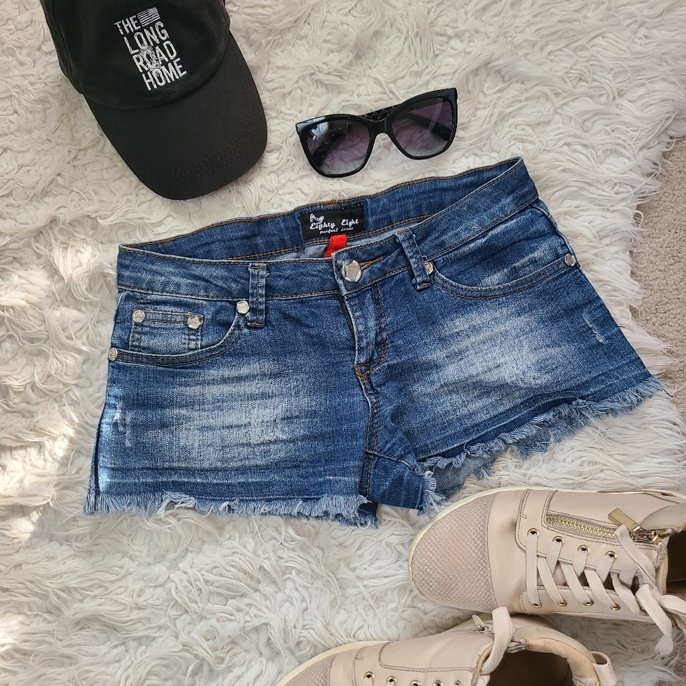 Low rise distressed jean shorts